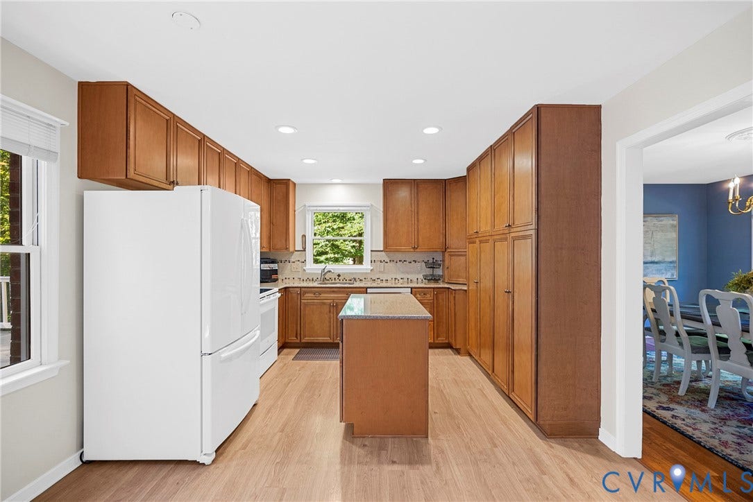 12082 Victoria Hills Road, Rockville, VA 23146 Kitchen featuring wood cabinetry, central island with stone countertop, recessed ceiling lighting, and wood-finish flooring