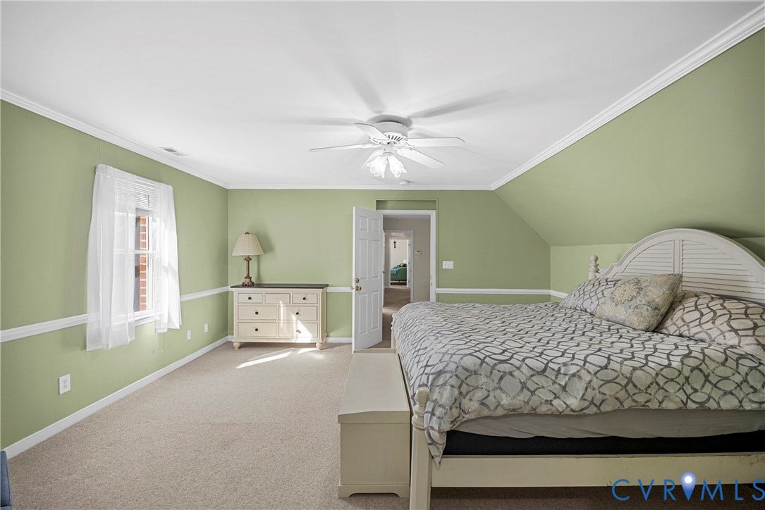 12082 Victoria Hills Road, Rockville, VA 23146 Room featuring vaulted ceilings, chair rail molding, wall-to-wall carpeting, and a central ceiling fan with integrated lighting