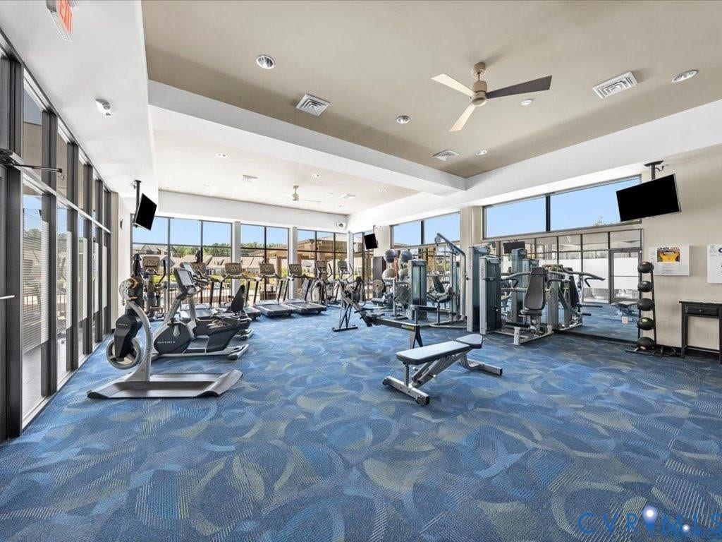 15801 Hallowell Ridge, #304, Moseley, VA 23120 Fitness center featuring expansive floor-to-ceiling windows, patterned carpeting, recessed lighting, and multiple ceiling fans