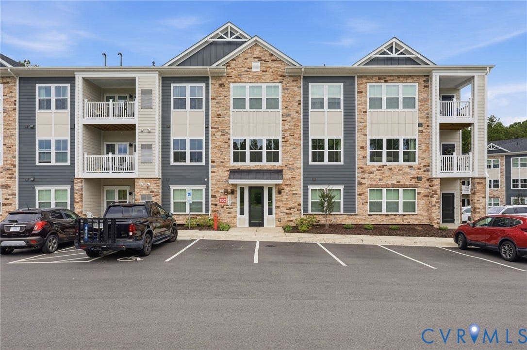 15801 Hallowell Ridge, #304, Moseley, VA 23120 Multi-story building featuring a stone and siding exterior