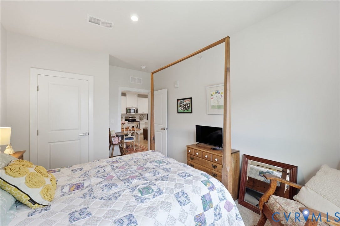 15801 Hallowell Ridge, #304, Moseley, VA 23120 Recessed ceiling lighting, white interior doors with contemporary hardware, light-toned wall finishes, and a framed opening to an additional room