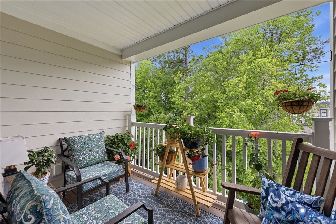 15801 Hallowell Ridge, #304, Moseley, VA 23120 Covered outdoor balcony featuring white railing and wood-finish flooring