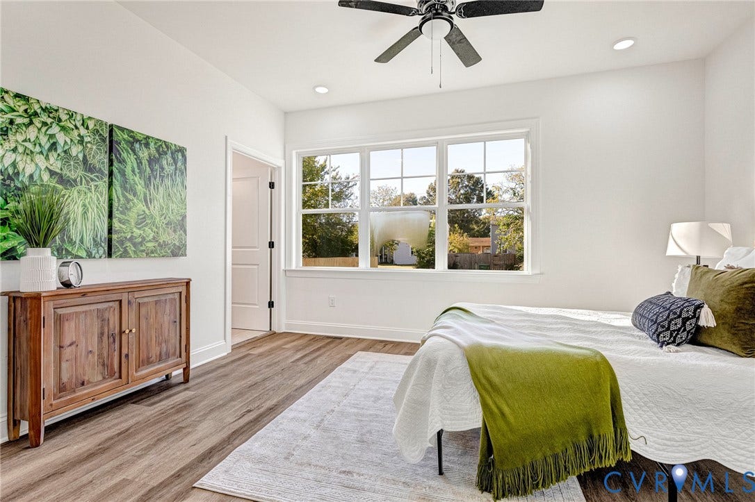 White walls with recessed lighting and a ceiling fan