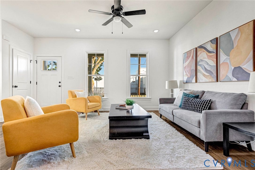 Recessed lighting, wood-finish flooring, and a ceiling fan with integrated lighting