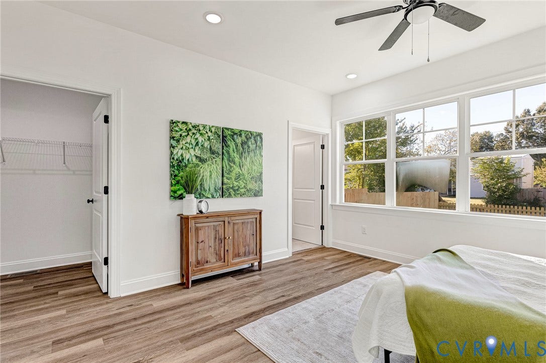 Recessed lighting, ceiling fan, wood-finish flooring, white trim, and multiple windows