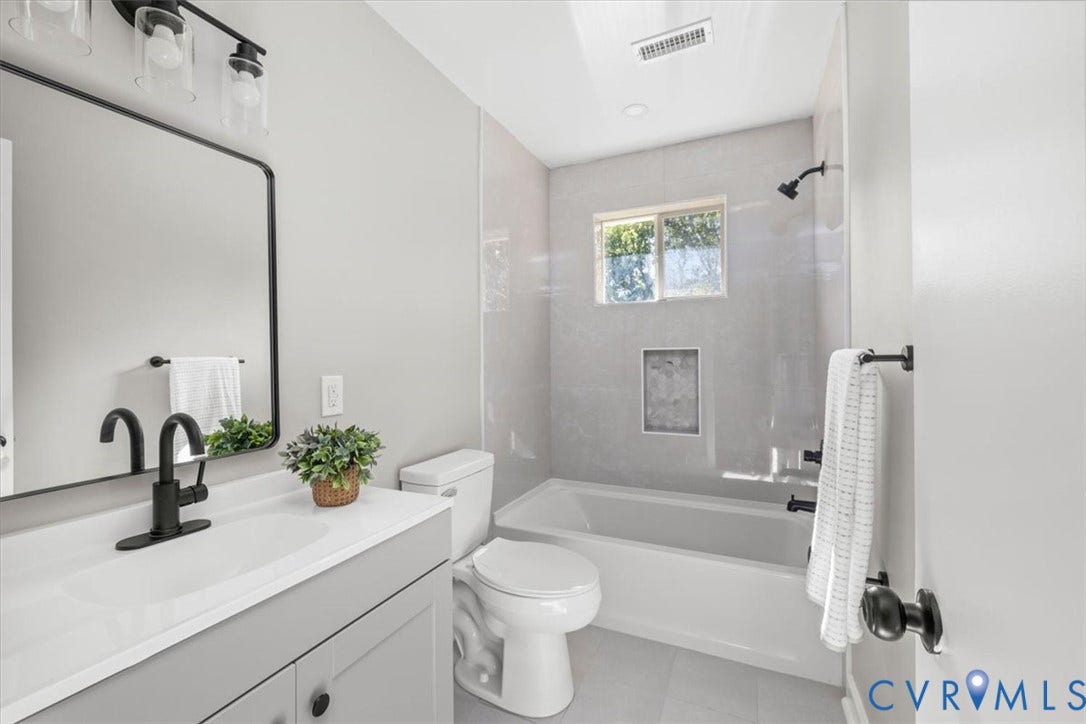 Light gray wall tile with a built-in shower niche