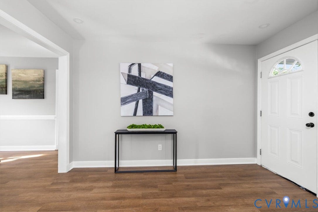Entryway featuring wood-finish flooring, light gray wall paint, and recessed ceiling lighting