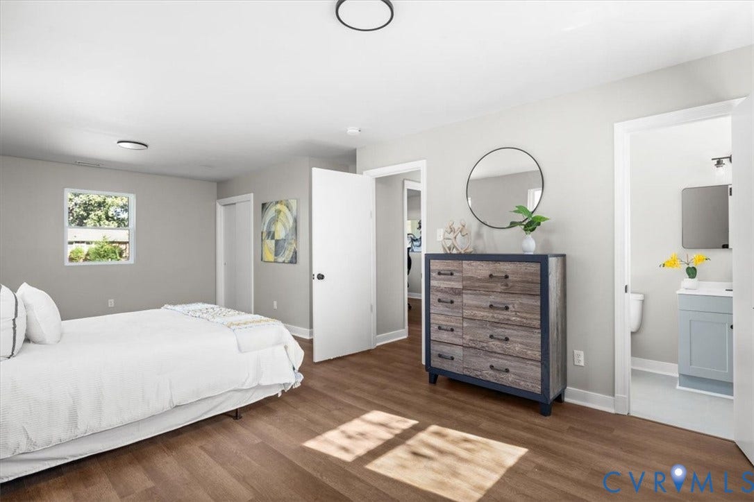 Wood-finish flooring, white doors, and light gray wall color
