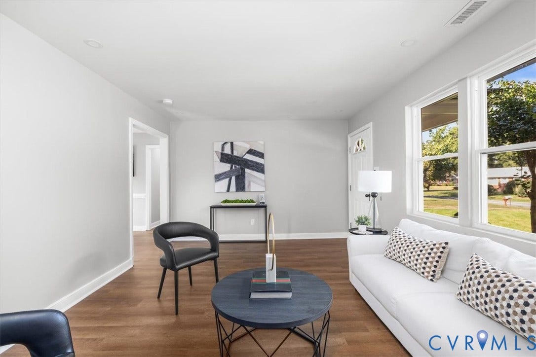 Recessed lighting, wood-finish flooring, white trim, and multiple large windows