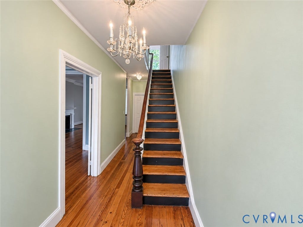 315 Grove Avenue, Petersburg, VA 23803 Hardwood flooring, crystal chandelier with ceiling medallion, painted staircase with turned newel post, and architectural trim throughout