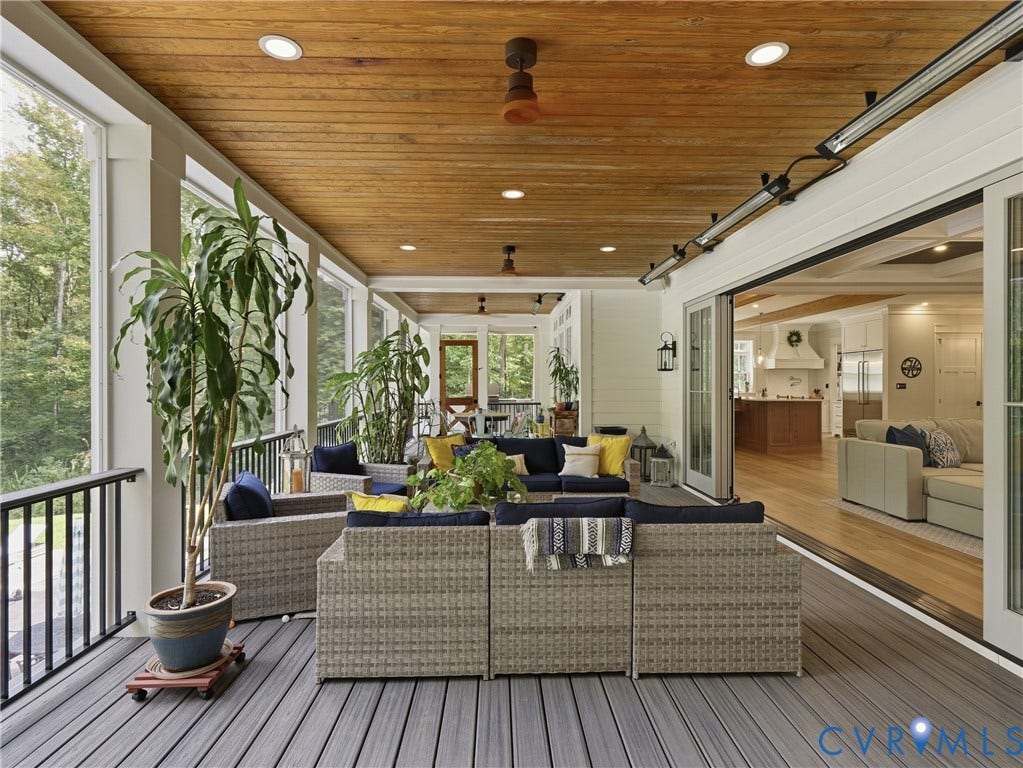 Screened porch featuring a wood-finish plank ceiling, recessed lighting, and composite decking