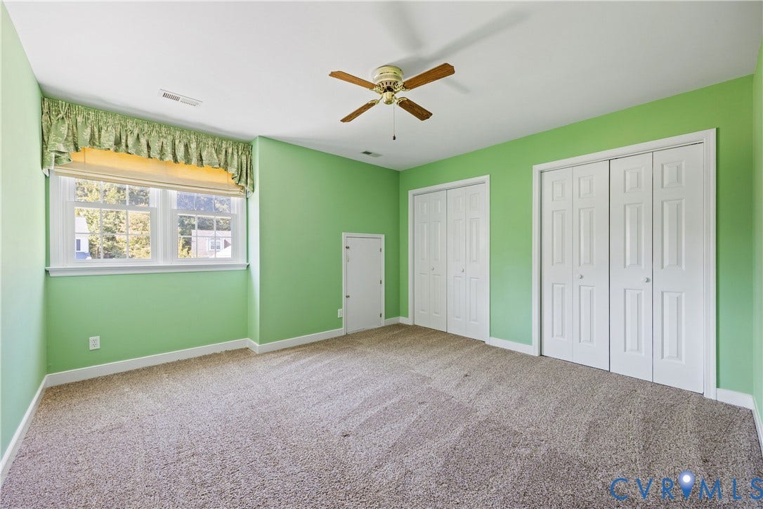 717 McCauliff Drive, Chesterfield, VA 23236 Double bi-fold closets, single bi-fold closet, ceiling fan, and carpeted flooring