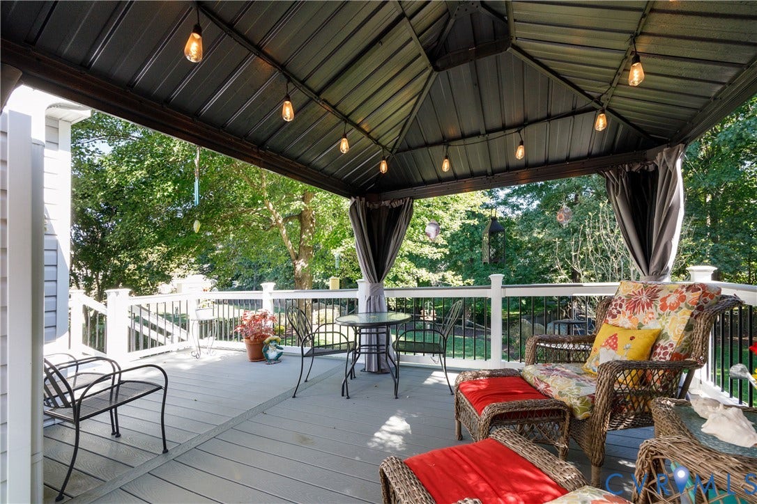 717 McCauliff Drive, Chesterfield, VA 23236 Covered deck with a metal gazebo roof, string lighting, and privacy curtains