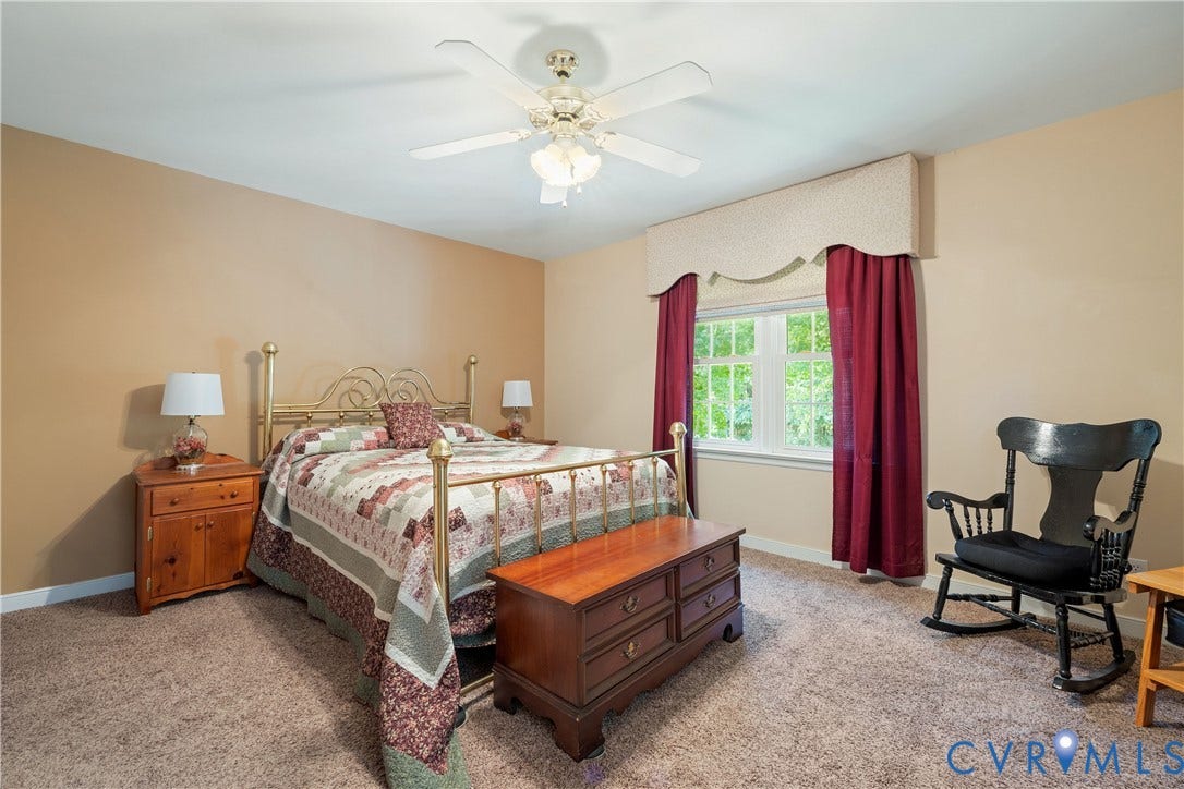 717 McCauliff Drive, Chesterfield, VA 23236 Recessed window with white trim, ceiling fan light fixture, wall-to-wall carpeting, and neutral wall paint