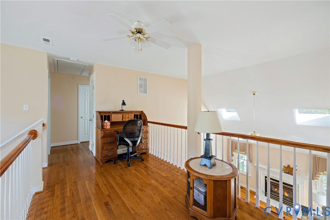 717 McCauliff Drive, Chesterfield, VA 23236 Hardwood-finish flooring, white spindle railing, skylights, overhead lighting, and ceiling fan