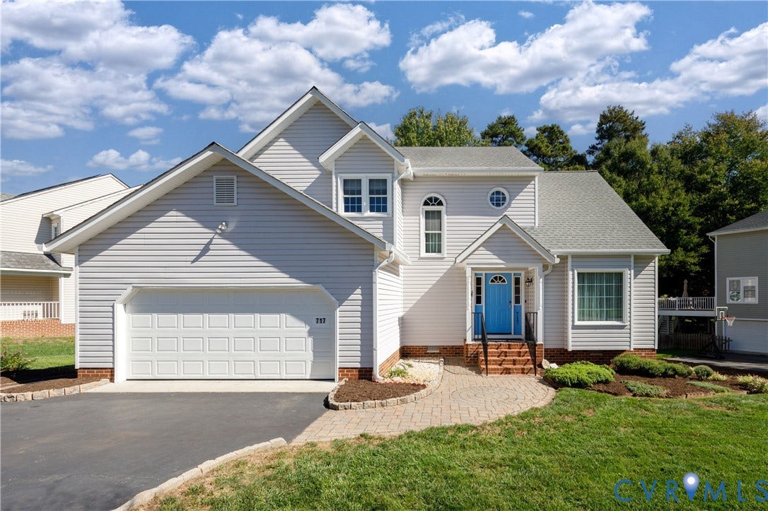 717 McCauliff Drive, Chesterfield, VA 23236 Siding exterior, an attached garage, and a paved driveway