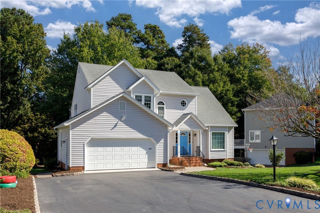 717 McCauliff Drive, Chesterfield, VA 23236 Light-colored siding exterior with an attached garage