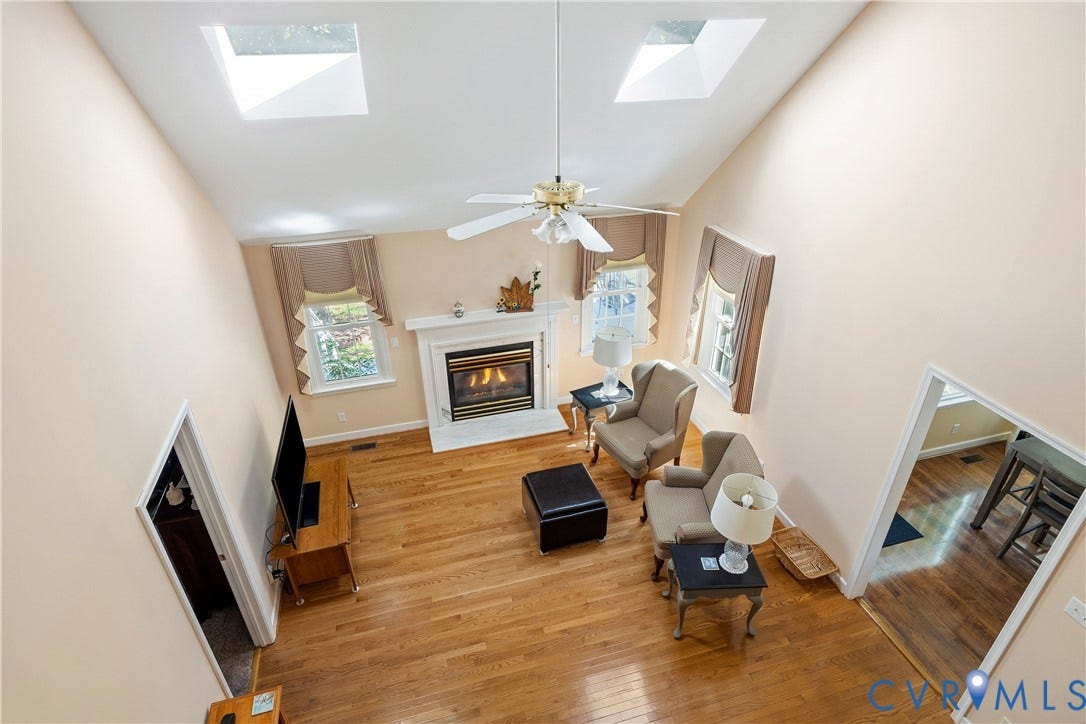 717 McCauliff Drive, Chesterfield, VA 23236 Vaulted ceiling featuring two skylights and a ceiling fan