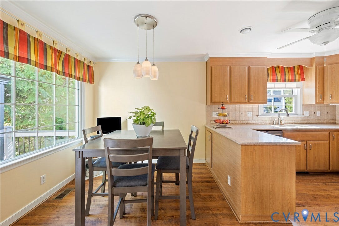 717 McCauliff Drive, Chesterfield, VA 23236 Expansive kitchen with wood-finish flooring, light wood cabinetry, and a window over the sink