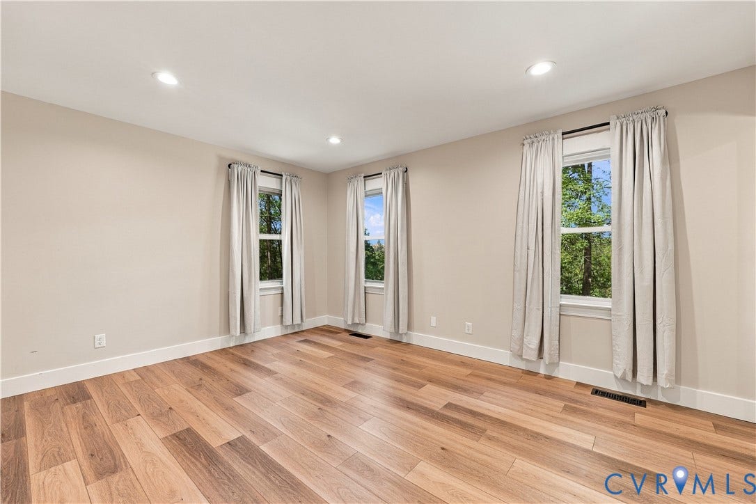 17 River Walk, Cumberland, VA 23027 Recessed lighting illuminates the expansive wood-finish flooring