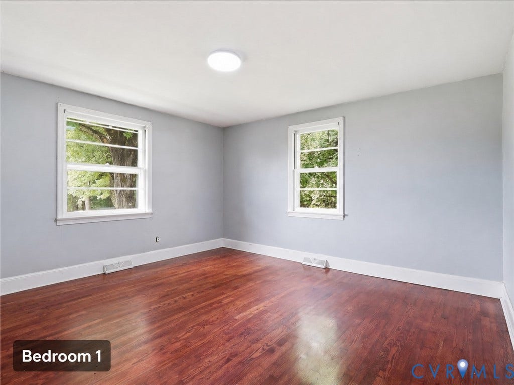 21600 Patrick Henry Highway, Amelia, VA 23083 Hardwood-style flooring with light gray walls, white trim, and two windows