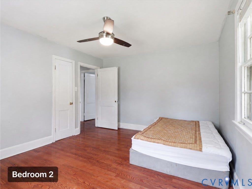 21600 Patrick Henry Highway, Amelia, VA 23083 Hardwood flooring, white trim, and a ceiling fan with light fixture