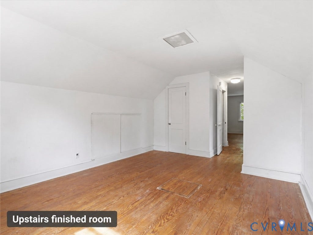 21600 Patrick Henry Highway, Amelia, VA 23083 Wood-finish flooring, white walls, angled ceiling, built-in access panels, and an overhead light fixture