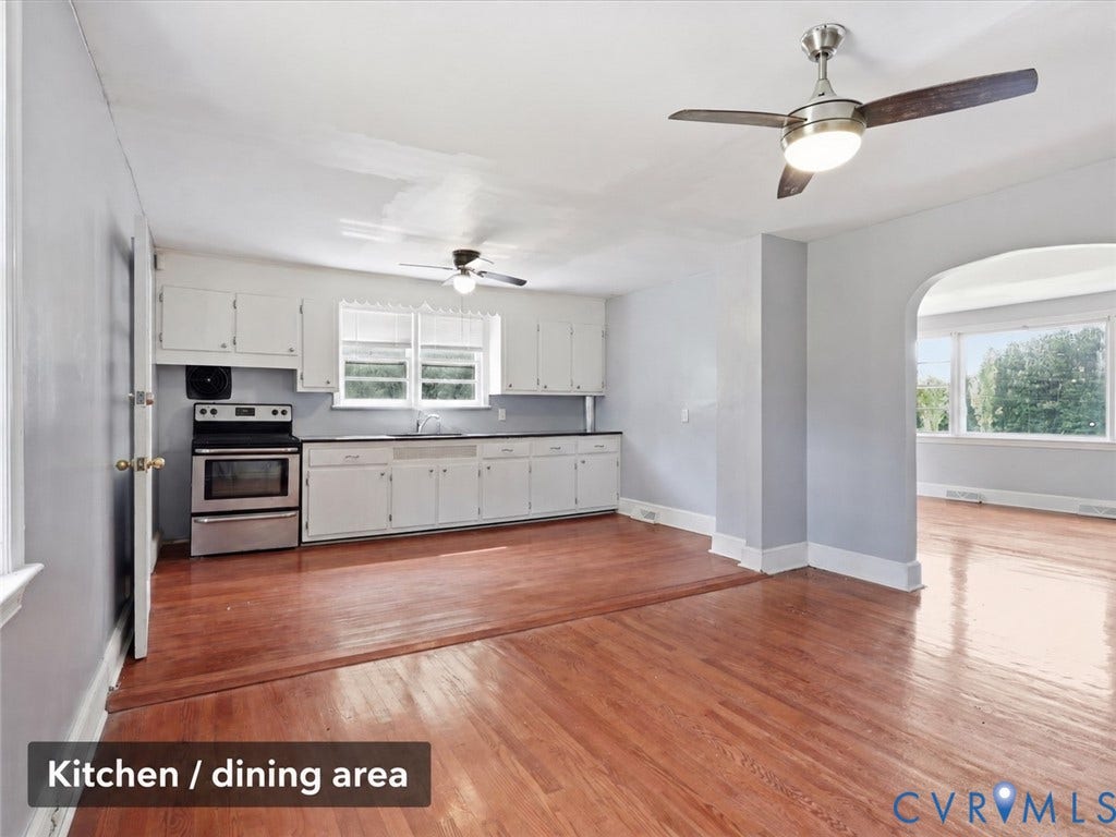 21600 Patrick Henry Highway, Amelia, VA 23083 Hardwood flooring, stainless steel range, white cabinetry, archway entry, and ceiling fans