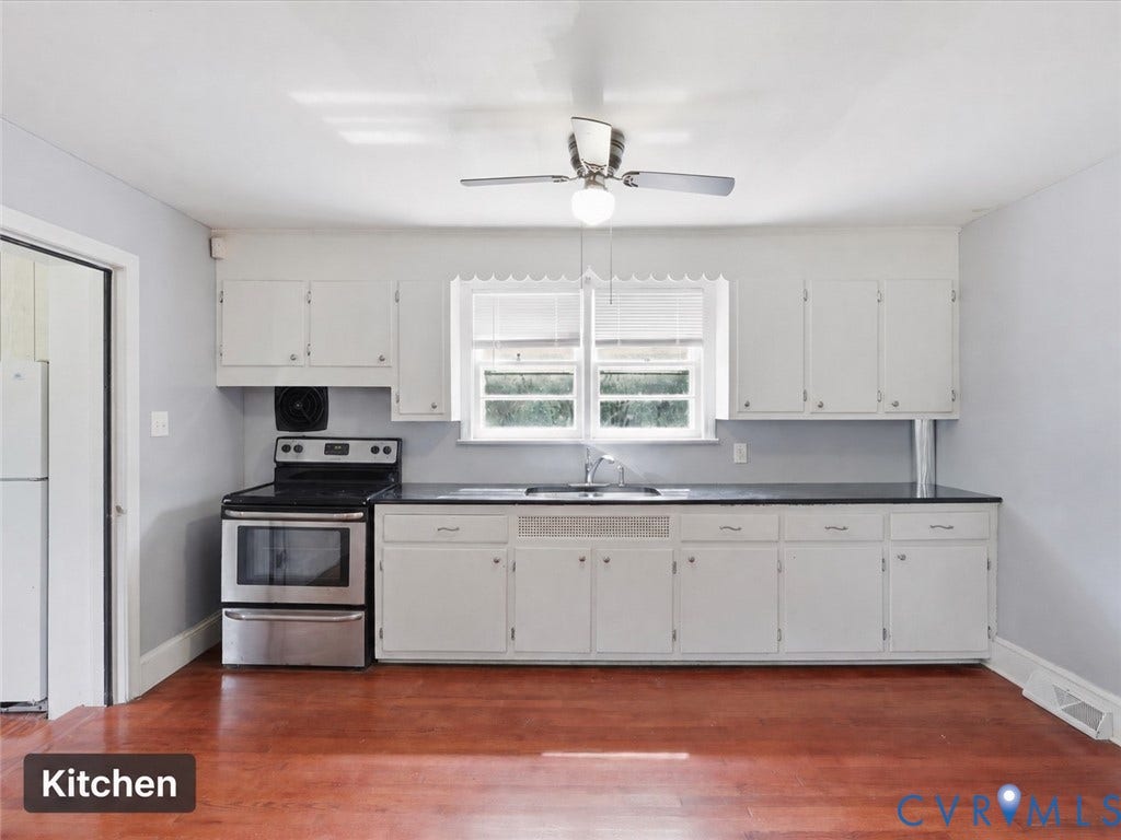 21600 Patrick Henry Highway, Amelia, VA 23083 Kitchen featuring wood-finish flooring, white cabinetry, dark countertops, and a stainless steel range with overhead hood