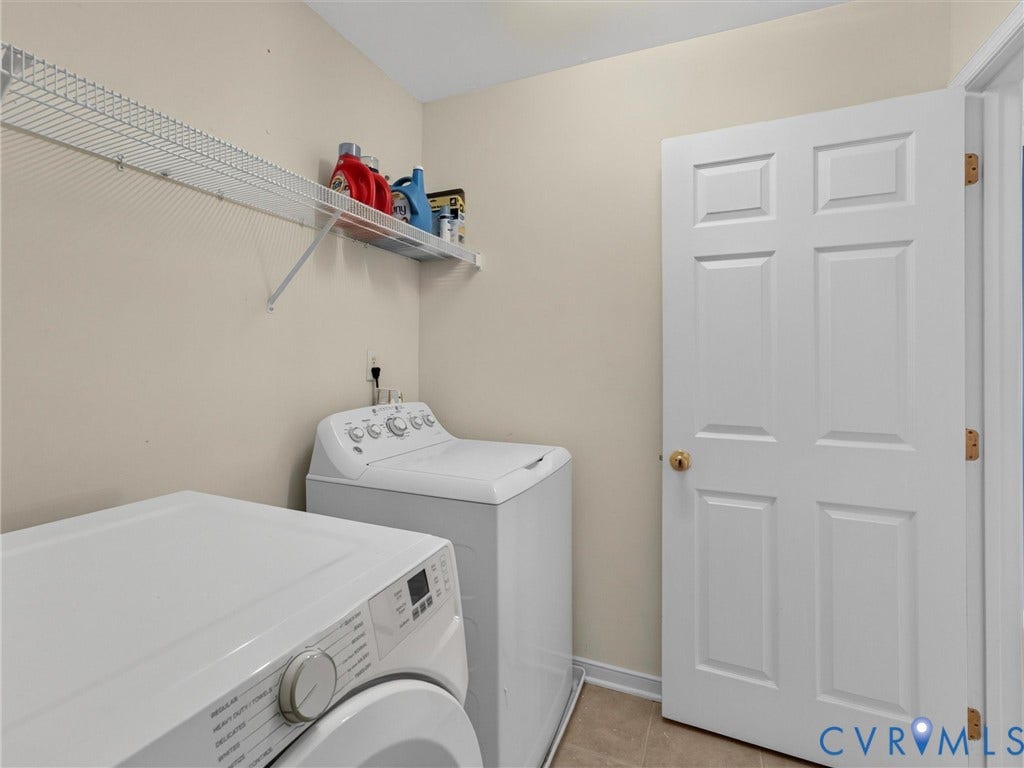 7478 Troub Lane, Elwin Place, Mechanicsville, VA 23111 Laundry area with tile flooring and a wire shelving unit