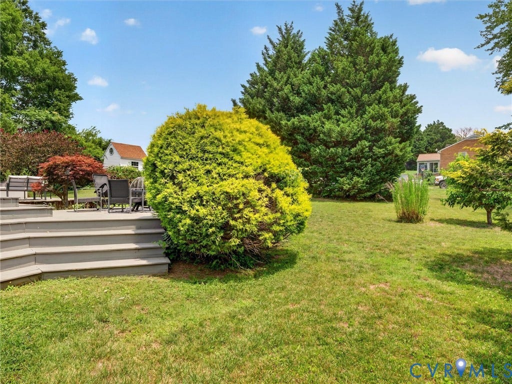 7478 Troub Lane, Elwin Place, Mechanicsville, VA 23111 Expansive green lawn with a multi-level deck featuring composite decking material