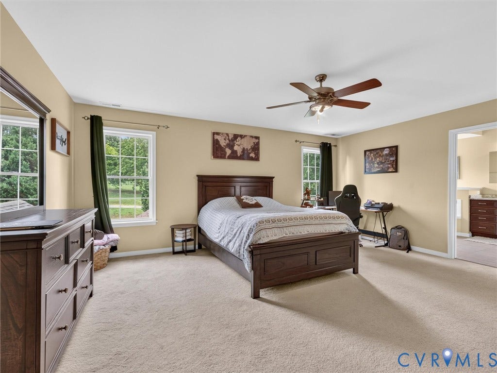 7478 Troub Lane, Elwin Place, Mechanicsville, VA 23111 Neutral wall color, wall-to-wall carpeting, ceiling fan with integrated lighting, and multiple windows
