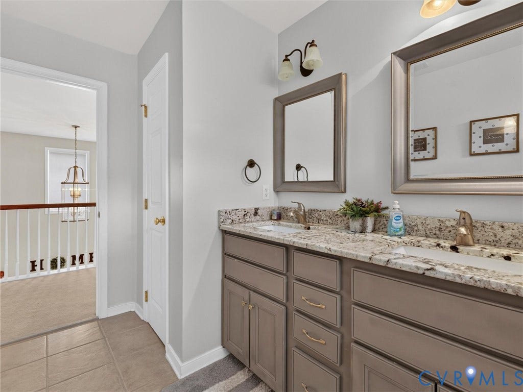 7478 Troub Lane, Elwin Place, Mechanicsville, VA 23111 Dual vanity with granite countertops, undermount sinks, and brushed gold fixtures