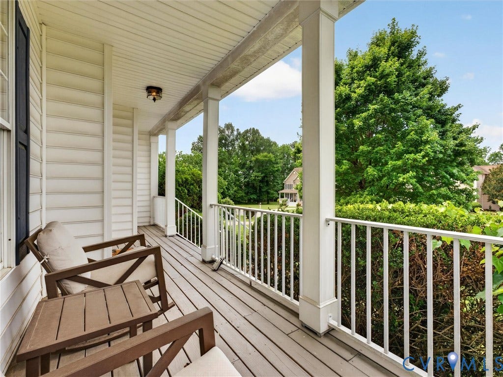 7478 Troub Lane, Elwin Place, Mechanicsville, VA 23111 Covered porch with wood-finish flooring, white columns, white railings, and a flush-mount light fixture