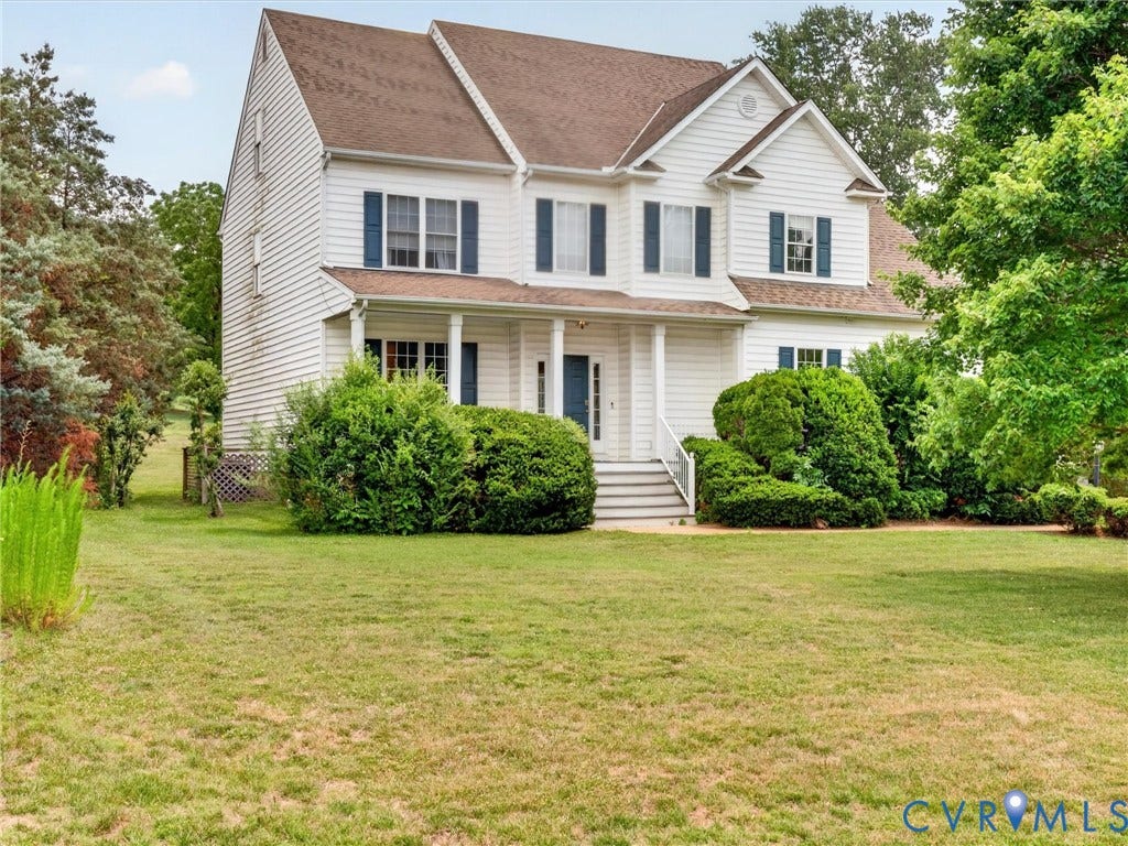 7478 Troub Lane, Elwin Place, Mechanicsville, VA 23111 Two-story white siding residence with a covered front porch, an arched portico, and contrasting dark blue shutters