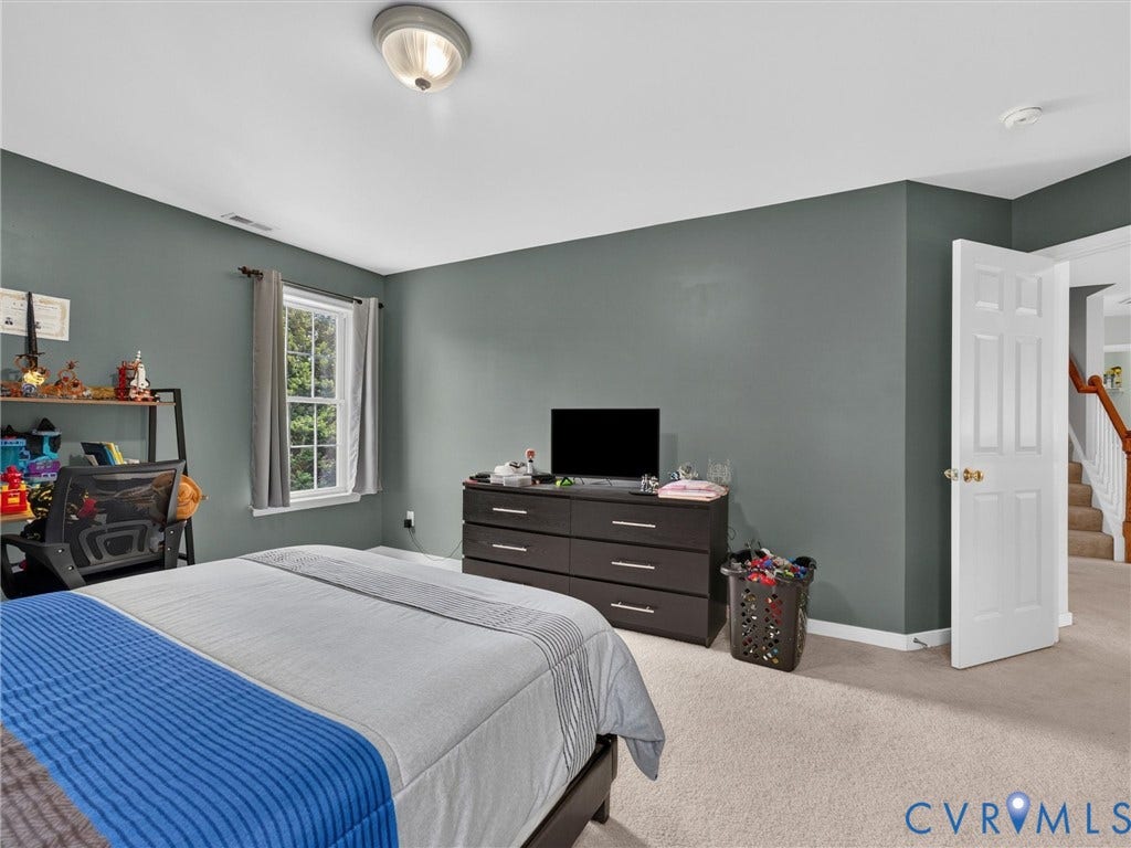 7478 Troub Lane, Elwin Place, Mechanicsville, VA 23111 Wall-to-wall carpeting with painted walls and a flush-mount ceiling light fixture
