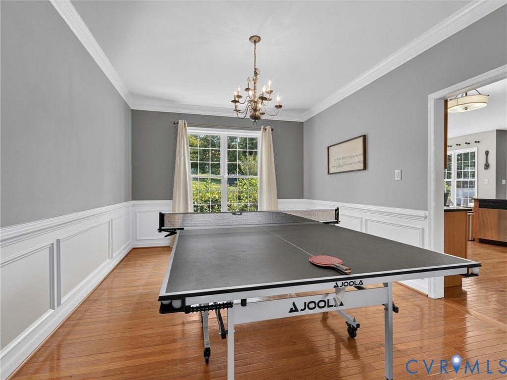 7478 Troub Lane, Elwin Place, Mechanicsville, VA 23111 Hardwood flooring, crown molding, chair rail, and picture frame wainscoting