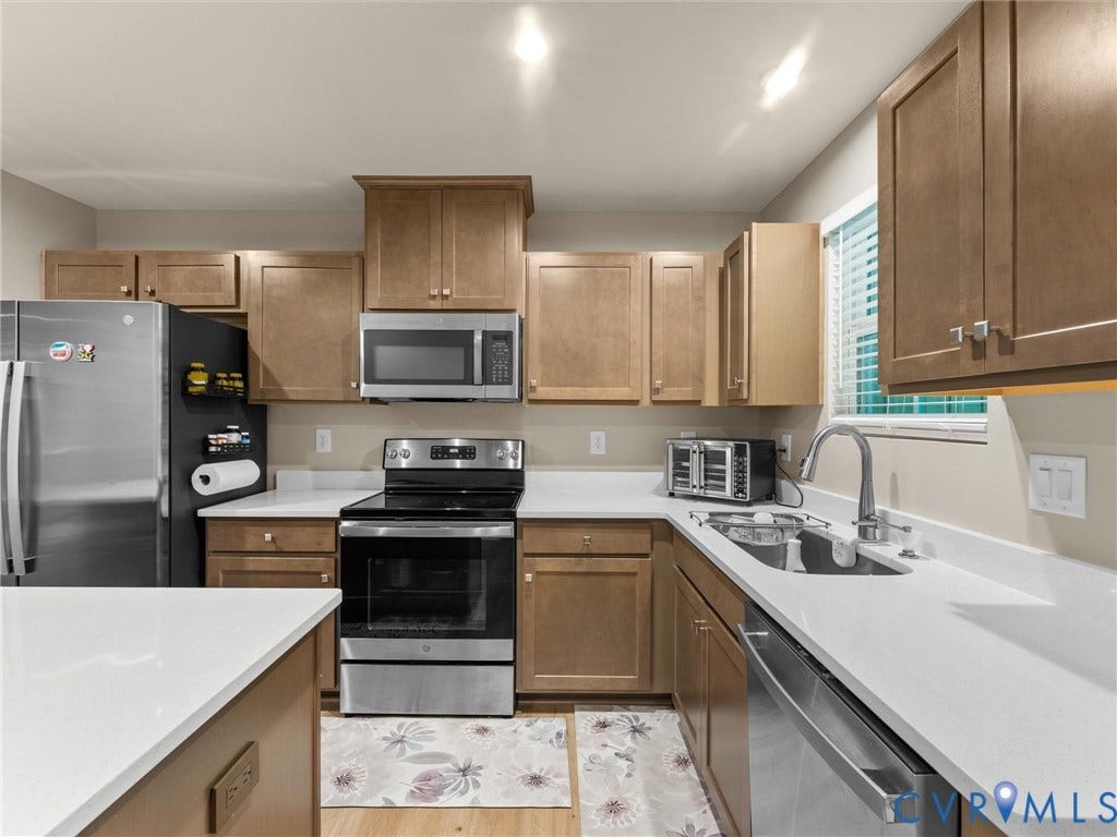 Wood-finish cabinetry paired with light-toned countertops