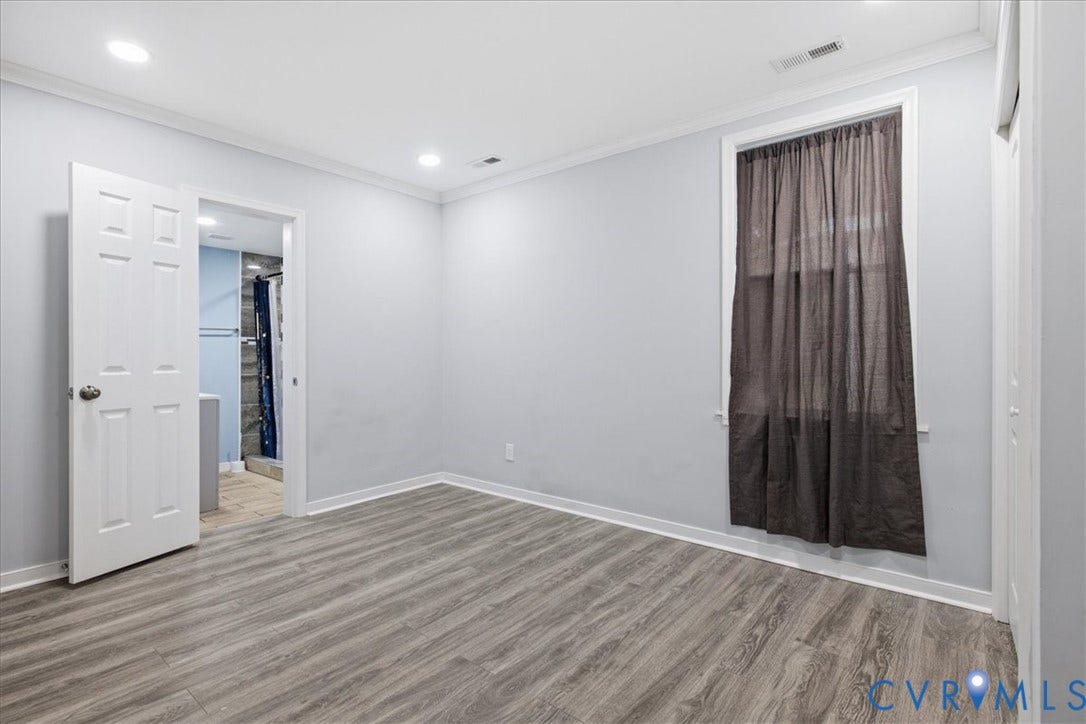 1630 W Washington Street, Petersburg, VA 23803 Wood-finish flooring with light wall tones and crown molding