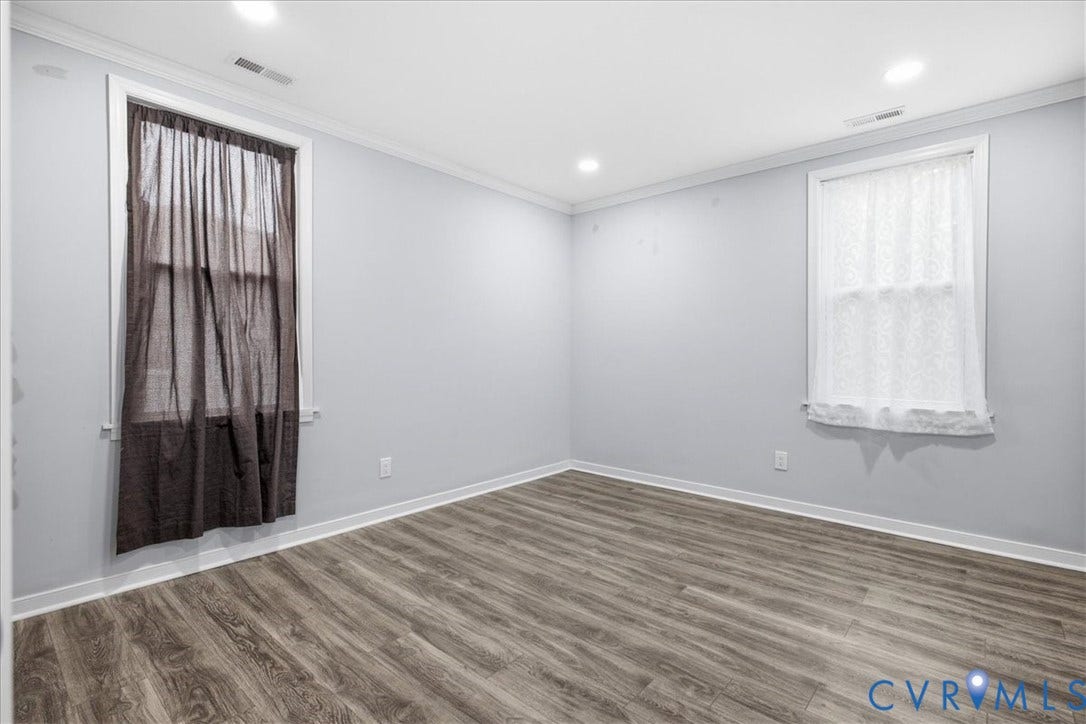 1630 W Washington Street, Petersburg, VA 23803 Recessed ceiling lighting, wood-finish flooring, white window trim, and crown molding