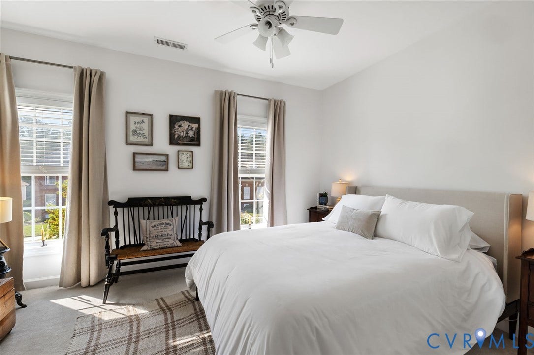 Neutral wall palette with a prominent ceiling fan