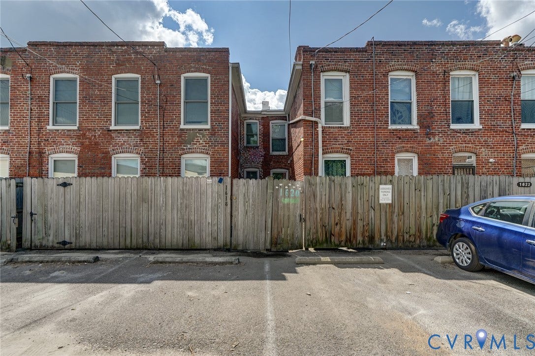 1620 W Cary Street, Fan Extenstion, Richmond, VA 23220 Brick facade with multiple windows and a wooden fence
