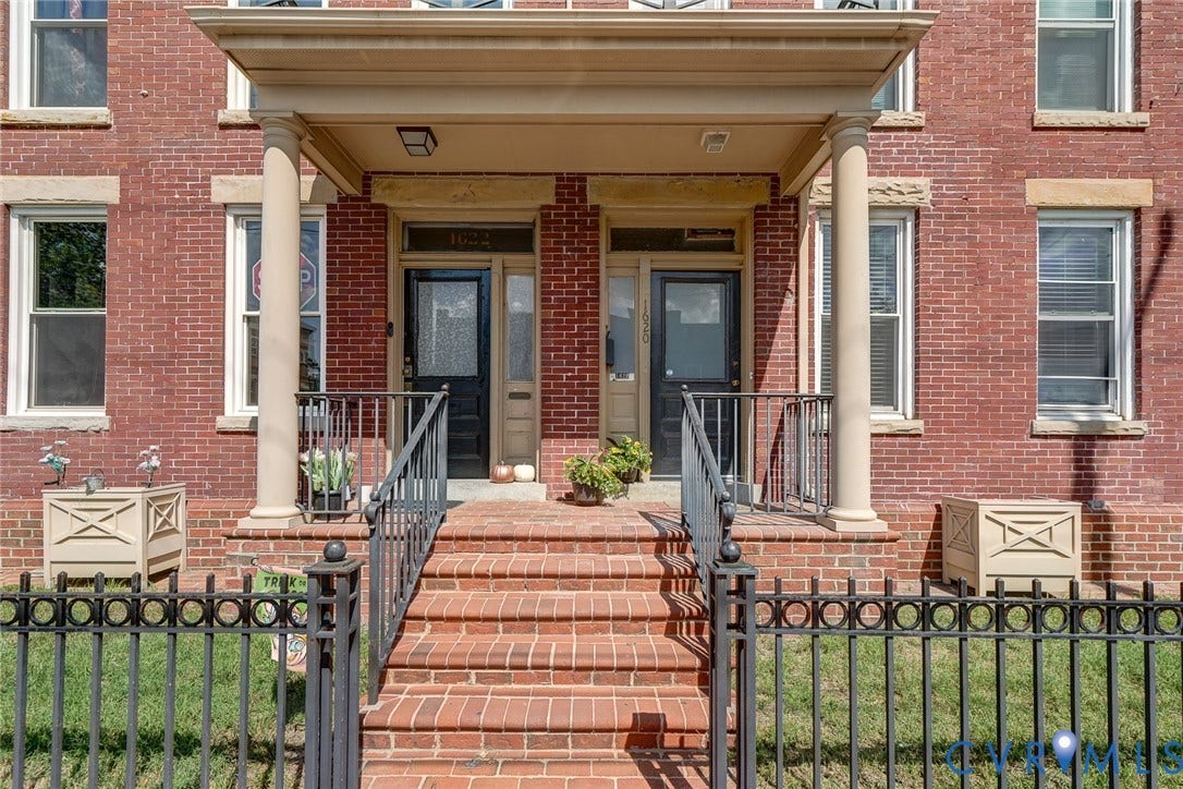1620 W Cary Street, Fan Extenstion, Richmond, VA 23220 Brick exterior with a covered porch featuring two columns, iron railings, and brick steps
