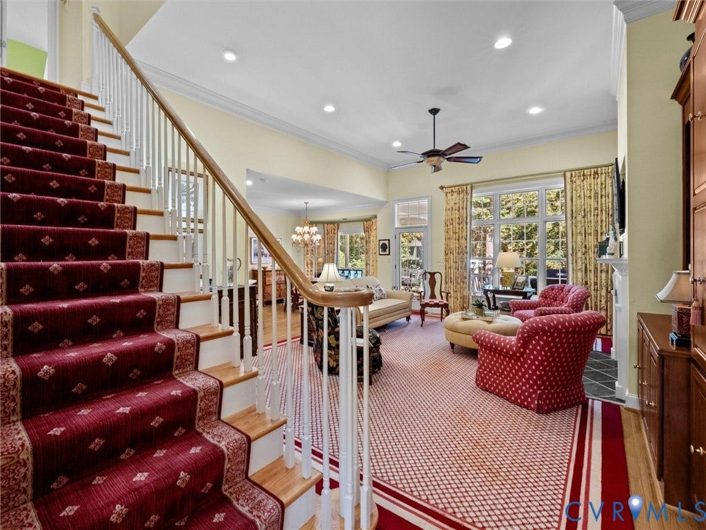Hardwood staircase with painted risers and balusters