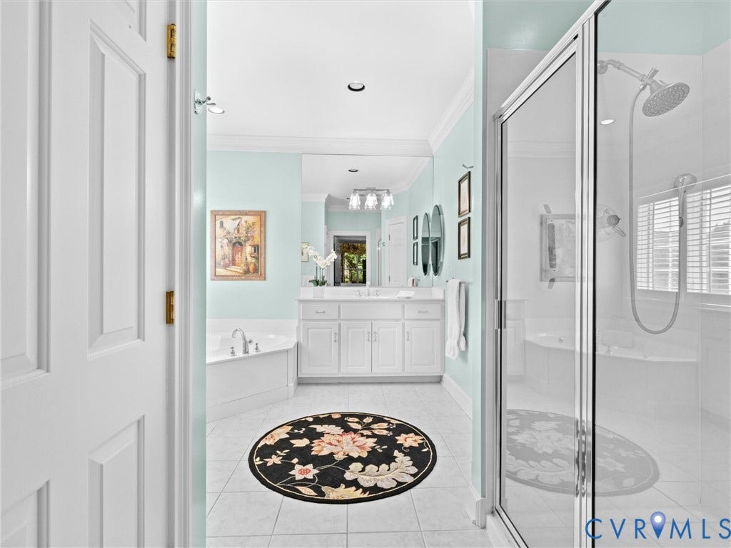 Tiled flooring complementing a corner soaking tub
