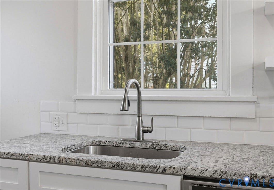 2900 Seminary Avenue, Northside, Richmond, VA 23220 Stainless steel undermount sink with pull-down faucet, granite countertop and subway tile backsplash.