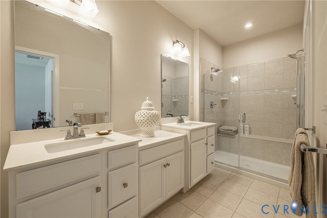 14336 Altavista Boulevard, Midlothian, VA 23114 Dual vanity with white cabinetry, integrated sinks, and light-toned countertops