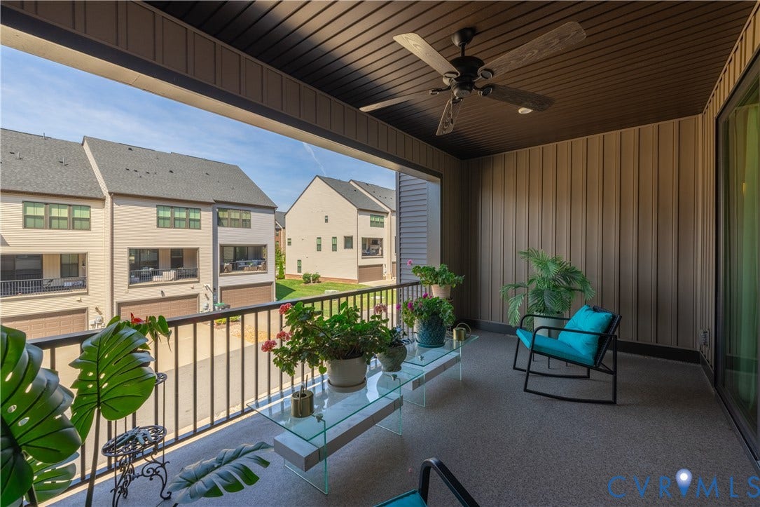 14336 Altavista Boulevard, Midlothian, VA 23114 Covered outdoor balcony with a ceiling fan, vertical panel siding, and a sliding glass door