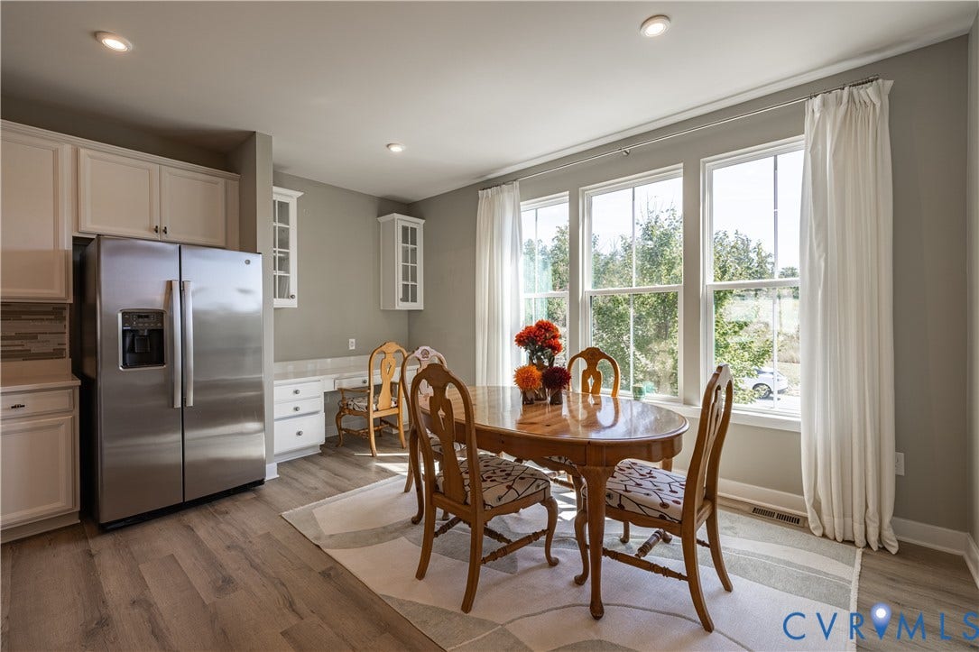 14336 Altavista Boulevard, Midlothian, VA 23114 Recessed lighting, wood-finish flooring, white cabinetry, stainless steel refrigerator, and a built-in desk area