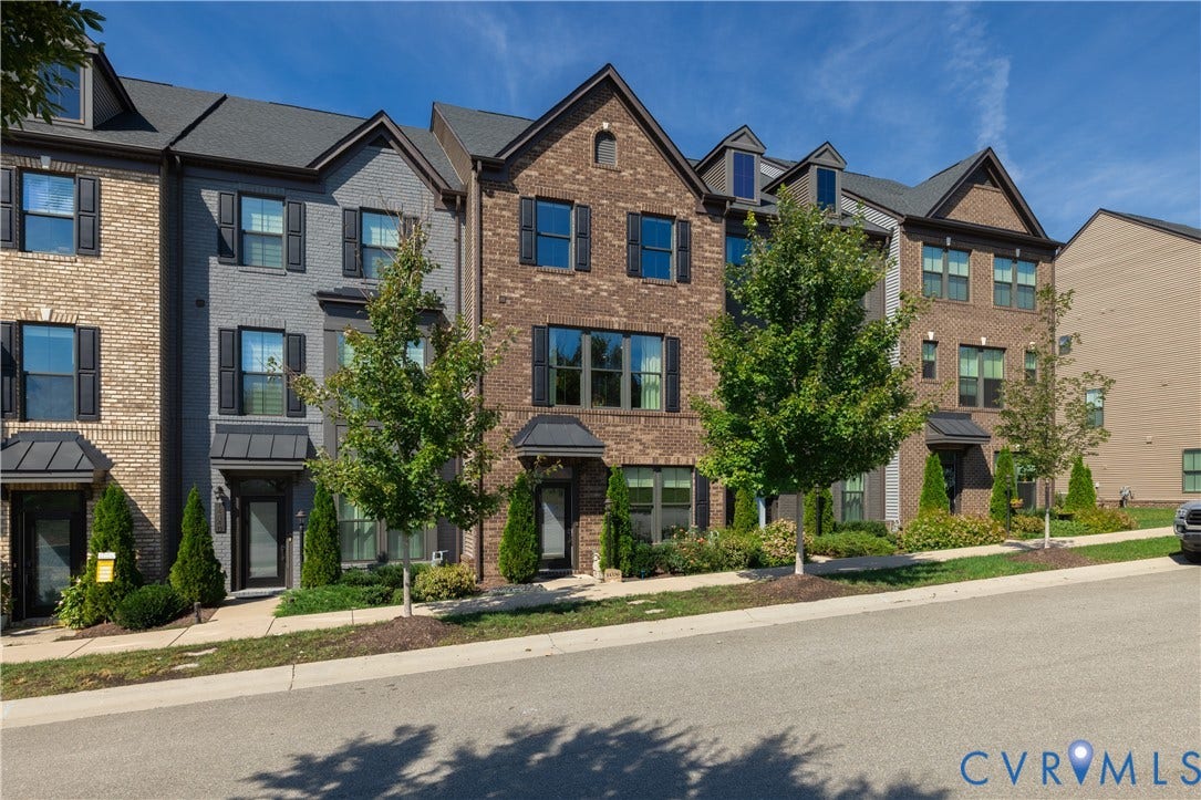 14336 Altavista Boulevard, Midlothian, VA 23114 Brick and stucco exterior with dark-framed windows, contrasting shutters, and covered entryways